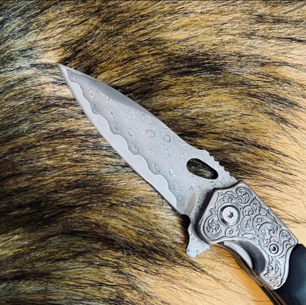 Diamond-patterned Damascus steel folding knife