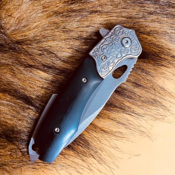 Diamond-patterned Damascus steel folding knife