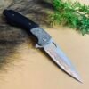 Diamond-patterned Damascus steel folding knife