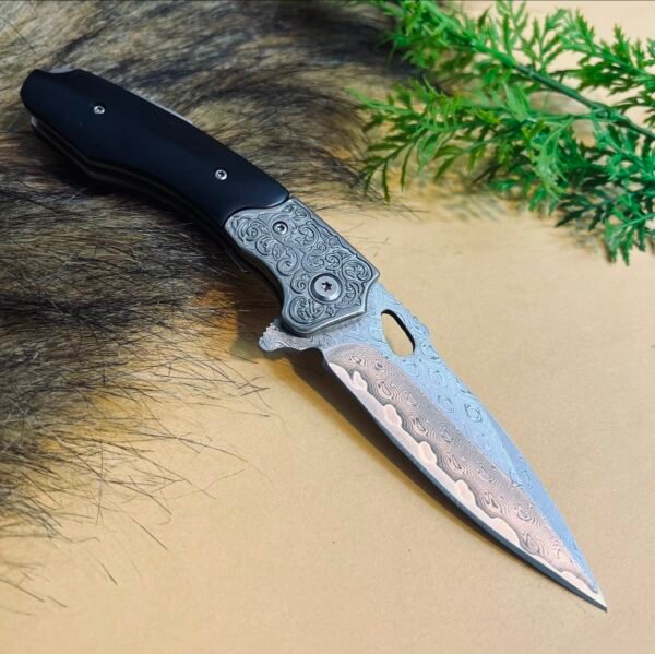 Diamond-patterned Damascus steel folding knife