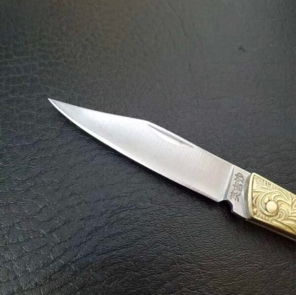 Brass folding knife
